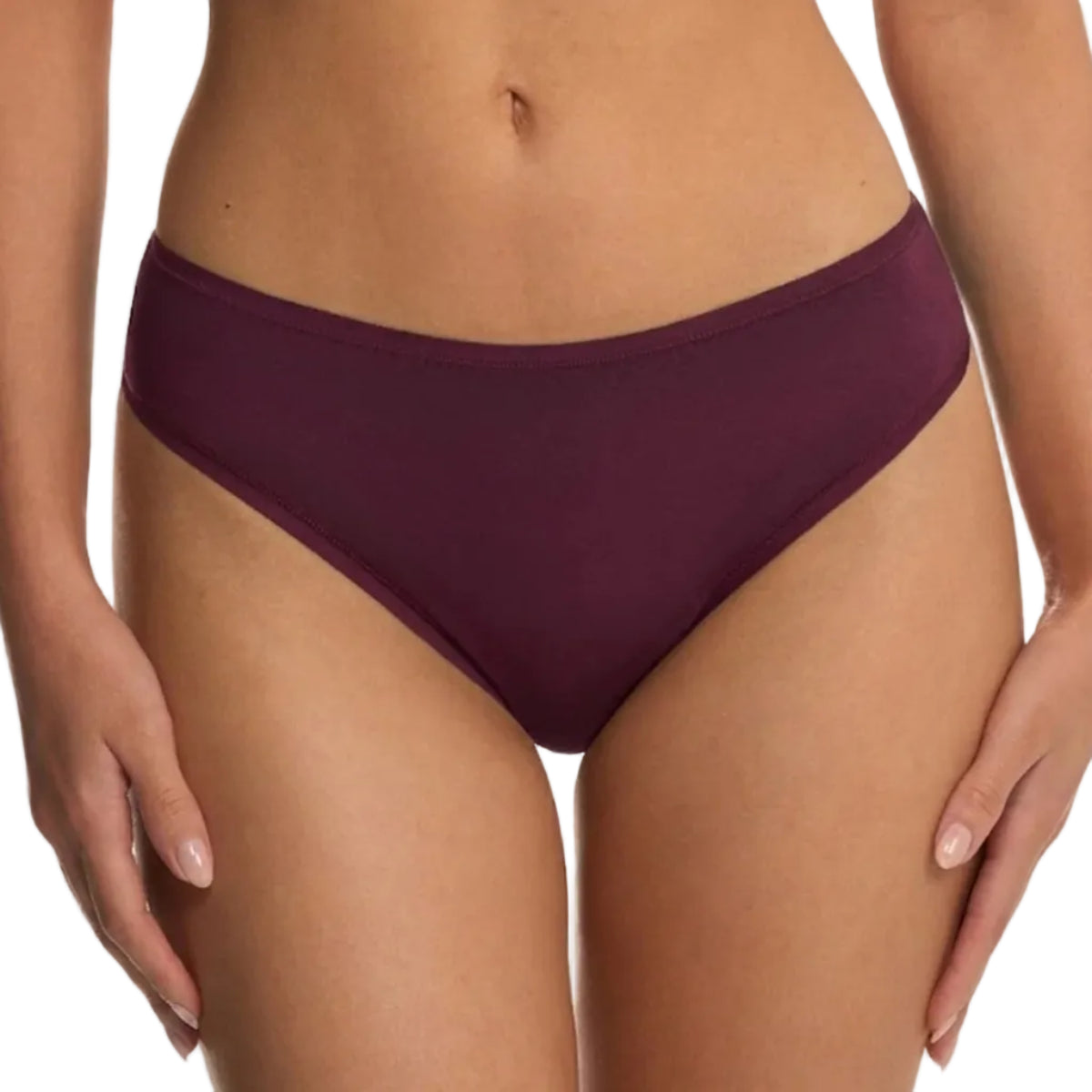 A close-up of a model wearing a pair of high-waisted, low-rise bikini bottoms in a deep plum purple color, shown against a plain white background.