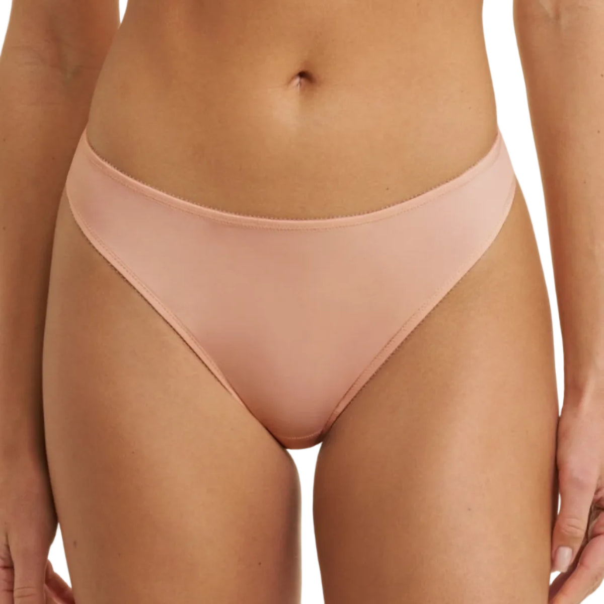 A close-up of a model wearing a solid pale pink bikini bottom against a plain white background.