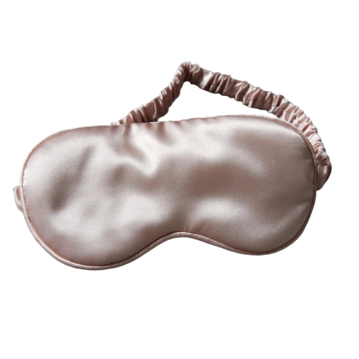 Silky sleep mask on a dark background with dried flowers