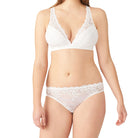 64391 Embrace Lace Bikini in Delicious White Beautiful and comfortable too, our Embrace Lace Bikini is the perfect addition to your lingerie collection. •	Full coverage bikini •	Lace front with sheer mesh back •	Sewn-in cotton gusset Fabric content: Body: 82% Nylon/18% Spandex; Lace: 48% Polyester/41% Nylon/11% Spandex; Crotch Lining:100% Cotton