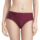 A model wearing a pair of high-waisted, solid burgundy underwear against a clean white background.