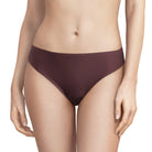 A model wearing a pair of low-rise, high-waisted bikini bottoms in a deep plum or aubergine color, shown from the waist to the upper thighs against a plain white background.