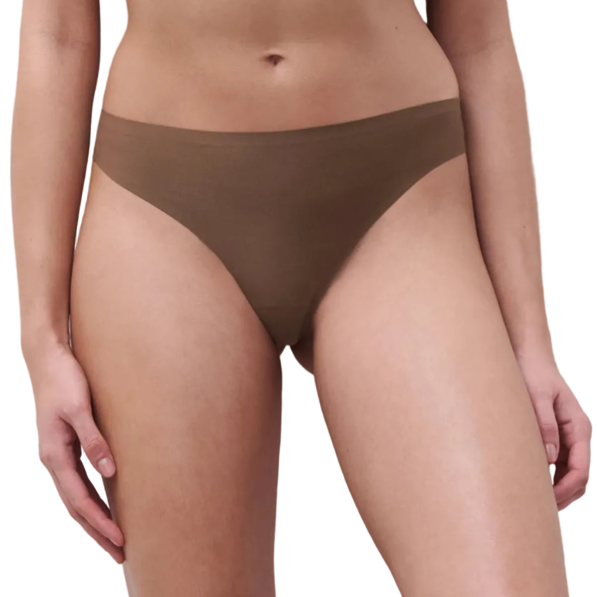 Person wearing brown underwear on a plain background