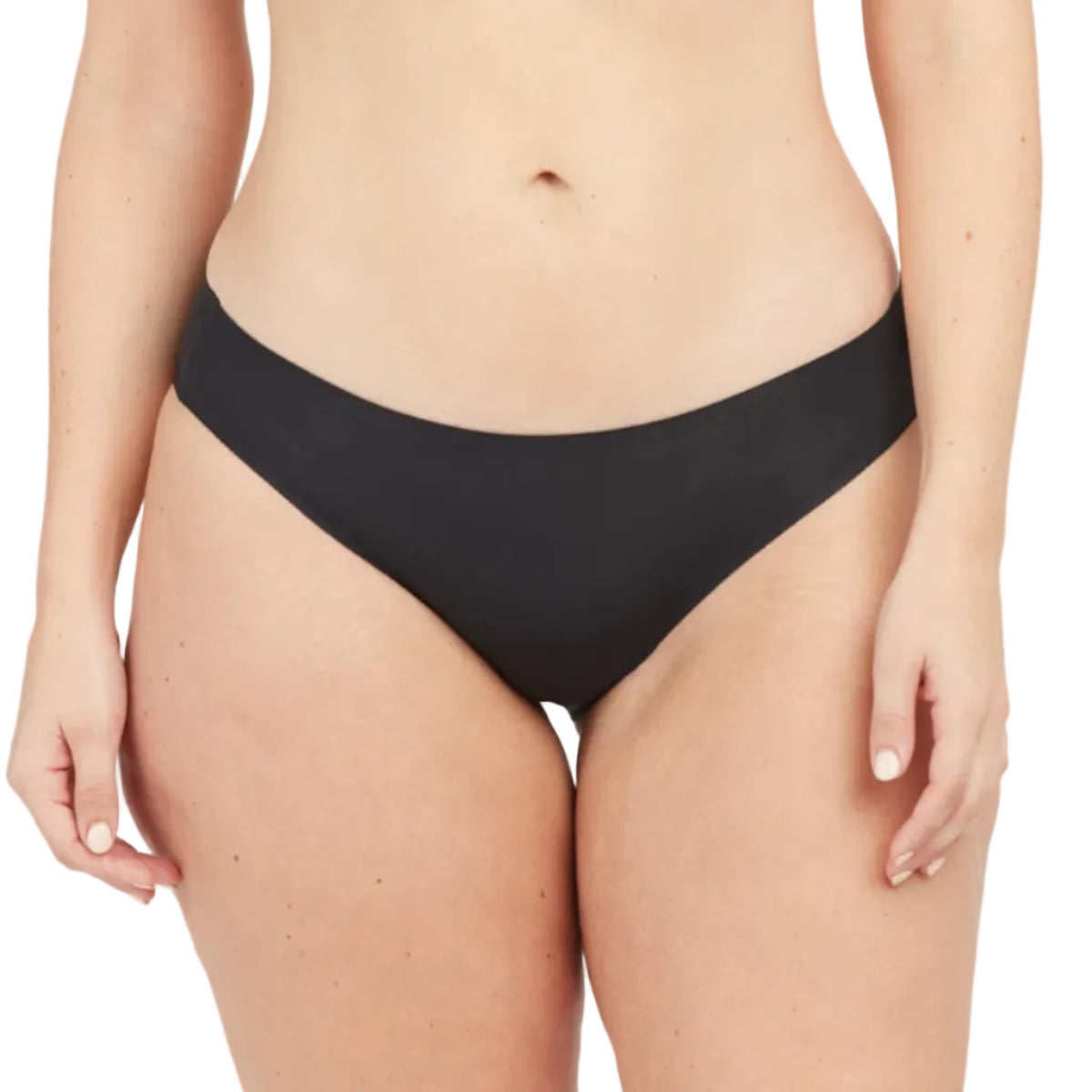 Black bikini bottom worn by a person on a white background