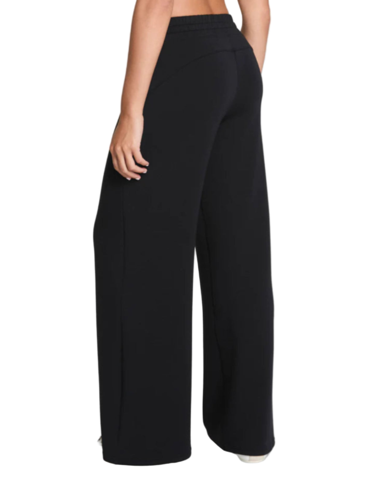 Black wide-leg pants worn by a person on a light gray background