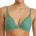 A model wearing a sage green lace-trimmed bra and matching underwear against a plain white background.