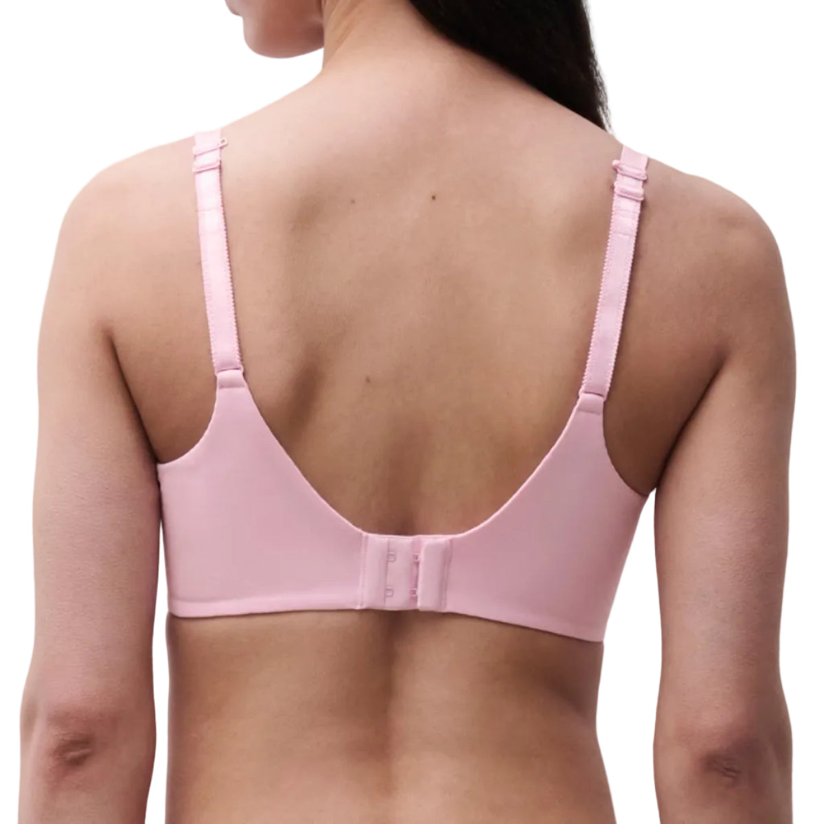 Pink bra worn by a person on a white background