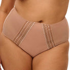 High-waisted beige underwear with lace details on a beige background