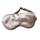 Silky sleep mask on a dark background with dried flowers