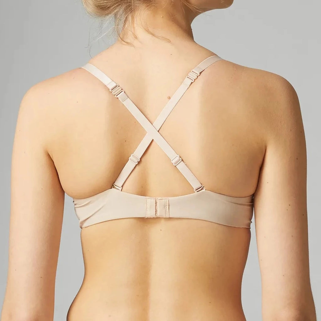 •	Unlined light beige t-shirt bra with underwire.This sleek, soft microfiber bra molds to your body and disappears under your clothes. it feels like a second skin and hugs your curves for a smooth, natural shape. Multi-position straps can be worn 3 ways: criss-cross shown