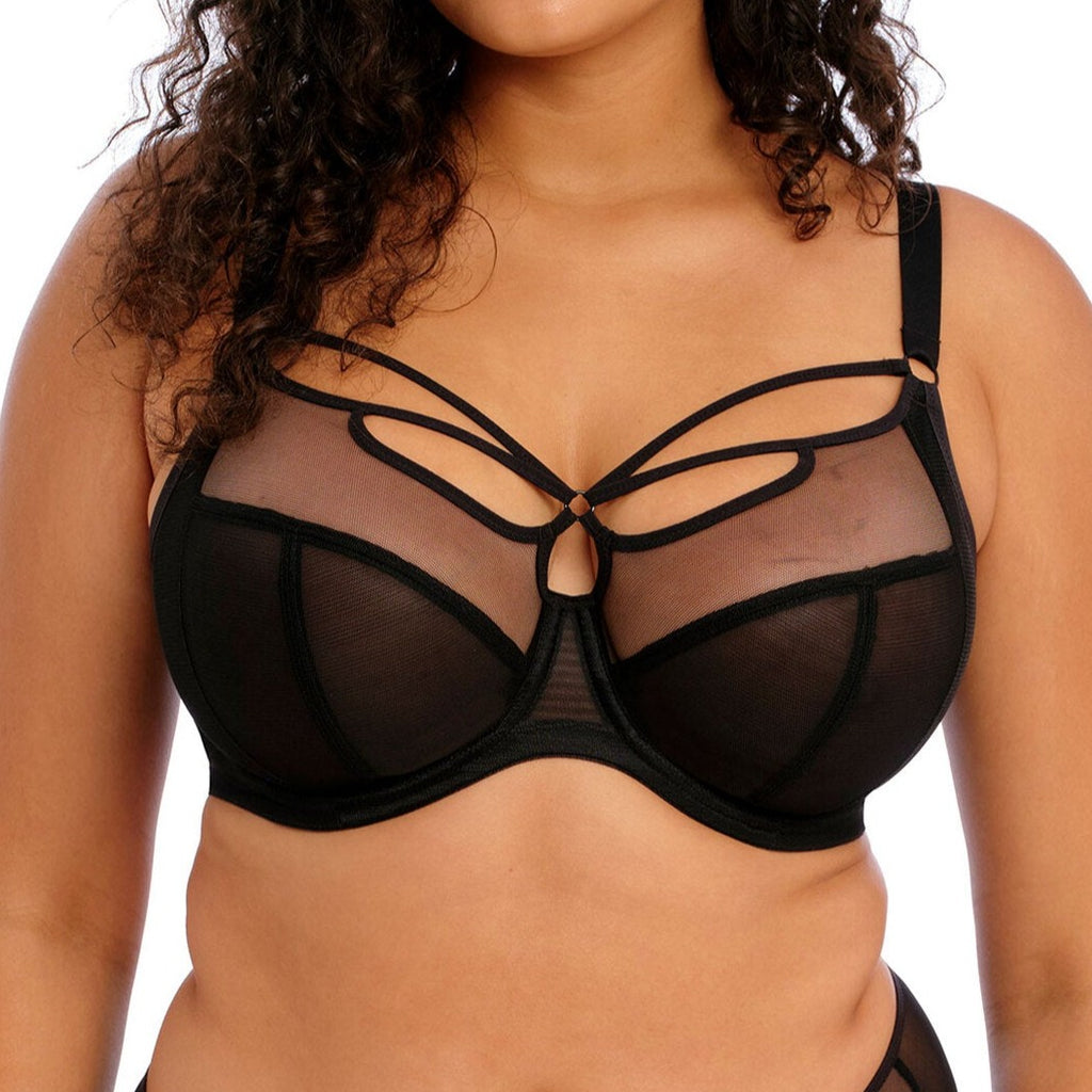 Sheer black mesh bra with strap detail. Supportive, comfortable, sexy bra is designed to be seen and emphasize cleavage. Low center front gives a plunging frame without pushing up Three piece cups plus side support panel creates forward shape and lift. Model front view. Your lingerie drawer will thank you!