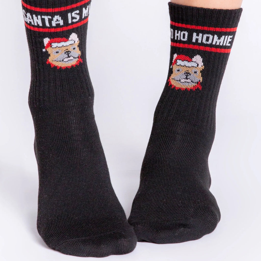Black socks featuring a French Bulldog wearing a Santa hat. Text above the dog reads Santa is my ho ho homie. Excellent gift for a French Bulldog parent.